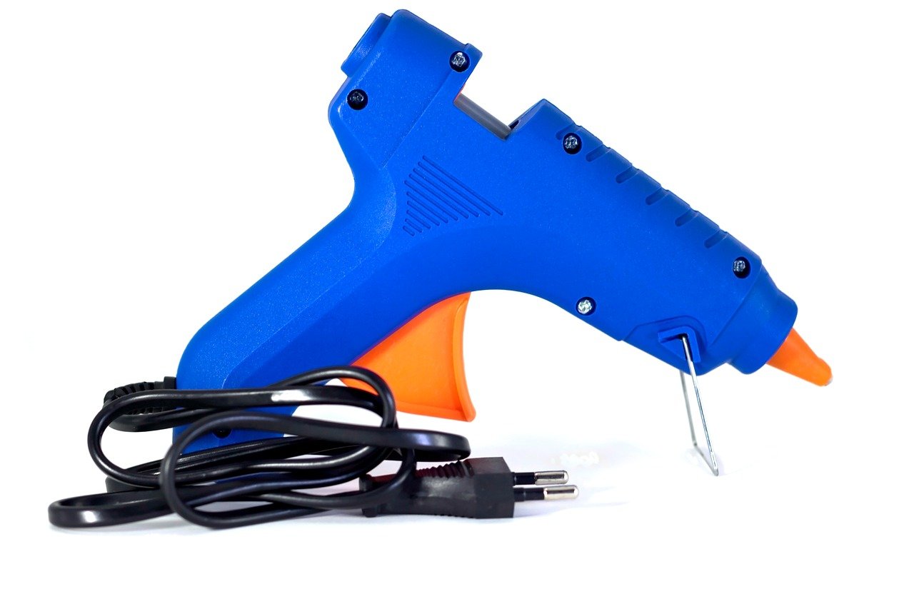 A blue, orange, and black glue gun